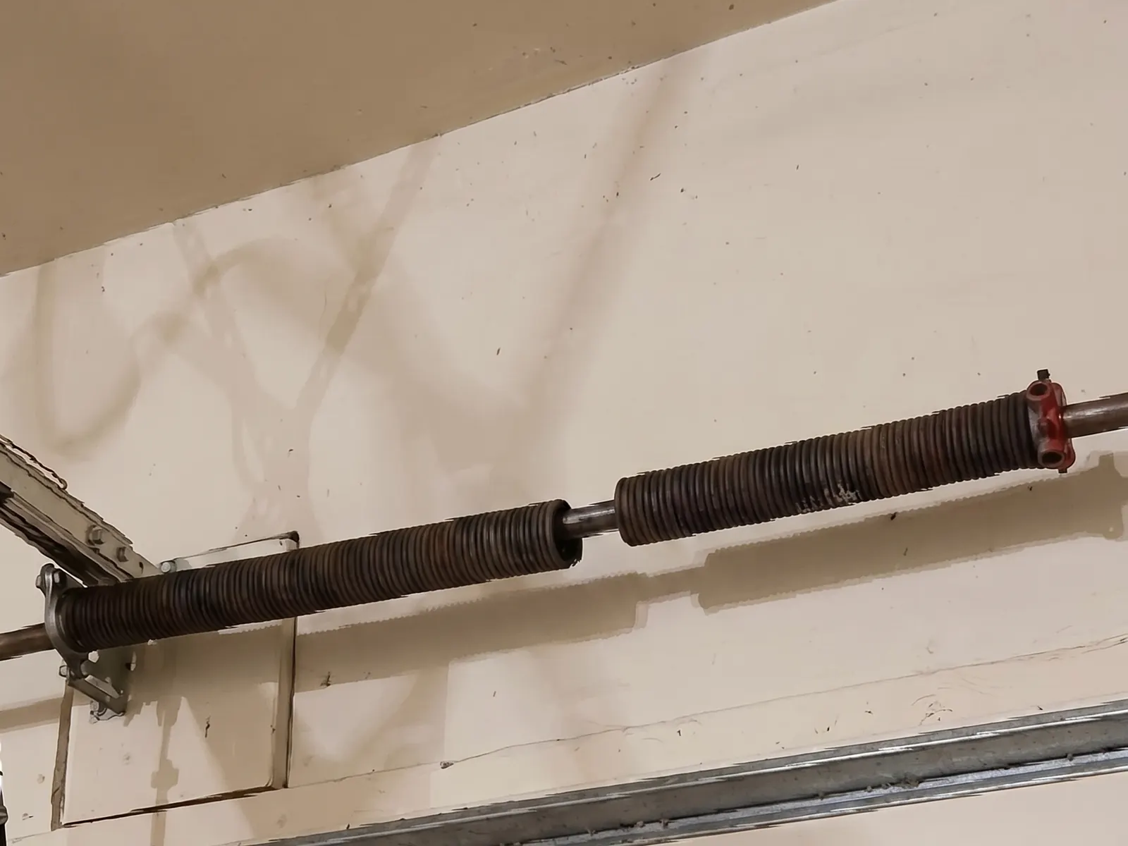 Broken torsion springs above a garage door