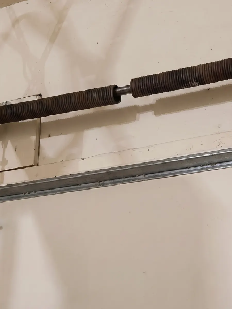 Broken torsion springs above a garage door