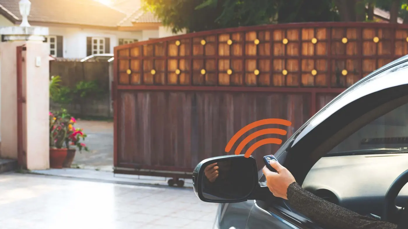 Driveway gate being opened with a remote from a car